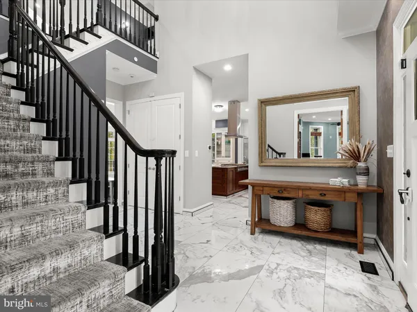 a kitchen with stainless steel appliances kitchen island granite countertop a sink and cabinets
