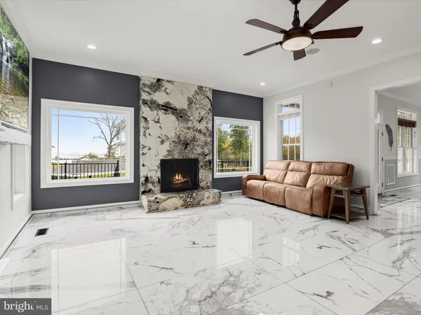 a kitchen with stainless steel appliances granite countertop a sink a stove and a wooden cabinets