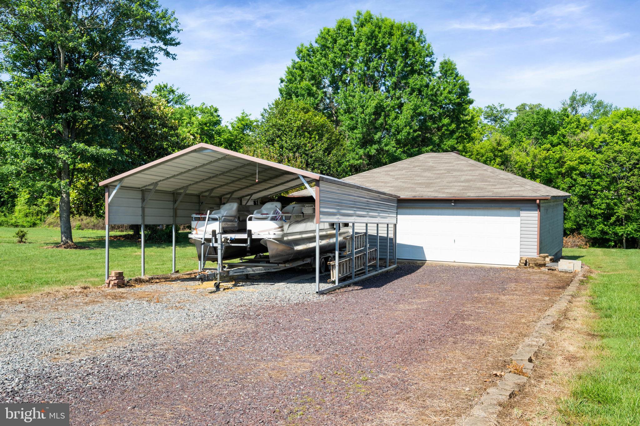 161 Troy Road Louisa, VA 23093 - Photo 2 of 60 a view of a house with a yard and sitting area