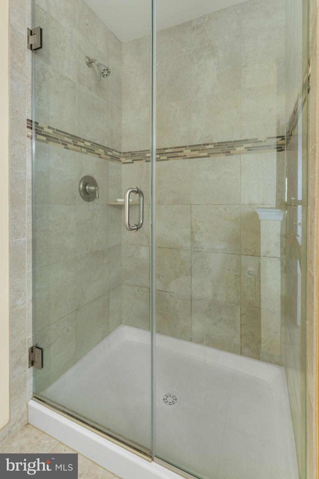 471 Truslow Road Fredericksburg, VA 22405 - Photo 27 of 33 Primary bathroom-glass shower, modern tile accents