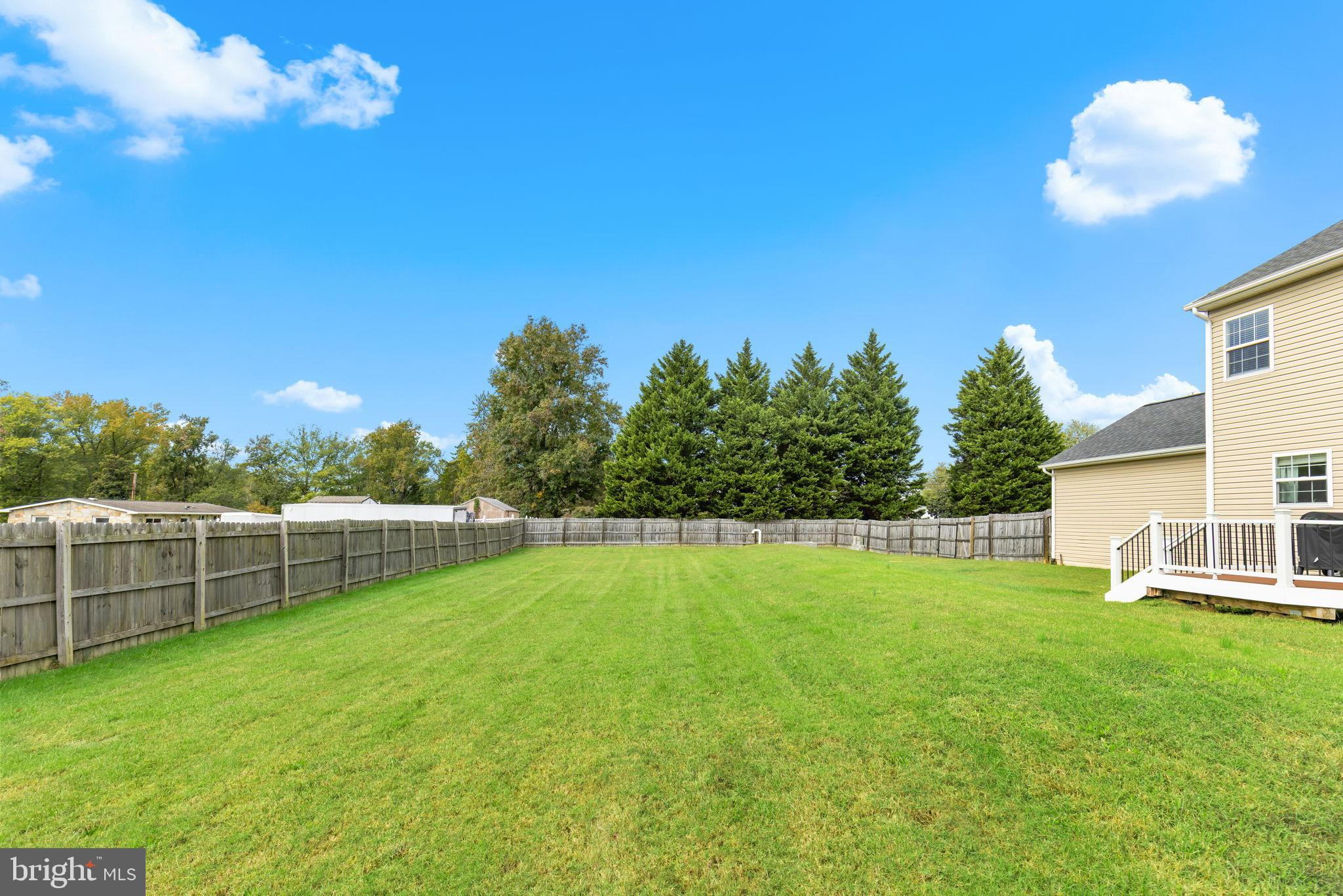 471 Truslow Road Fredericksburg, VA 22405 - Photo 30 of 33 Spacious backyard with lush green lawn.