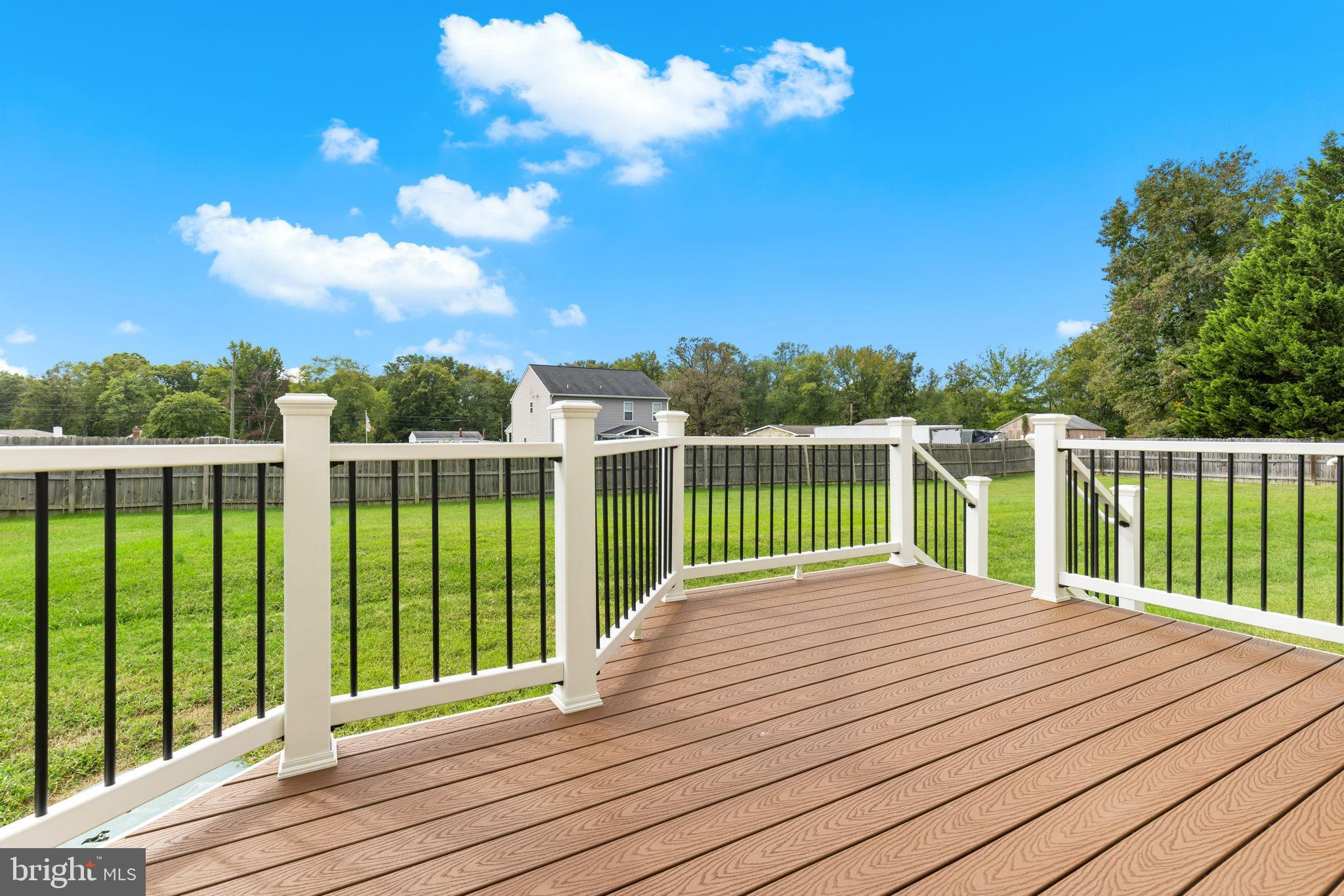 471 Truslow Road Fredericksburg, VA 22405 - Photo 6 of 33 Sunny deck overlooking lush green yard.