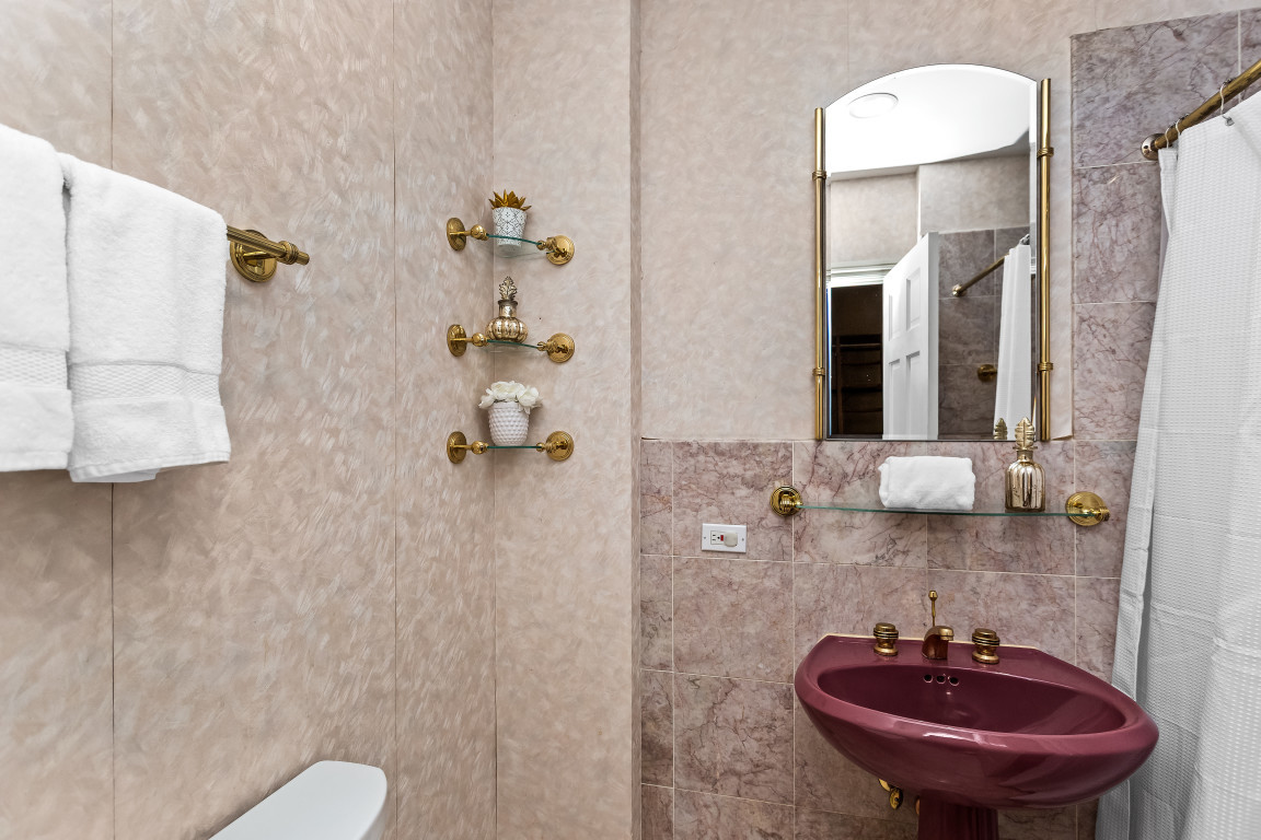 2236 Ridge Avenue Evanston, IL 60201 - Photo 25 of 68 a bathroom with a sink and a mirror