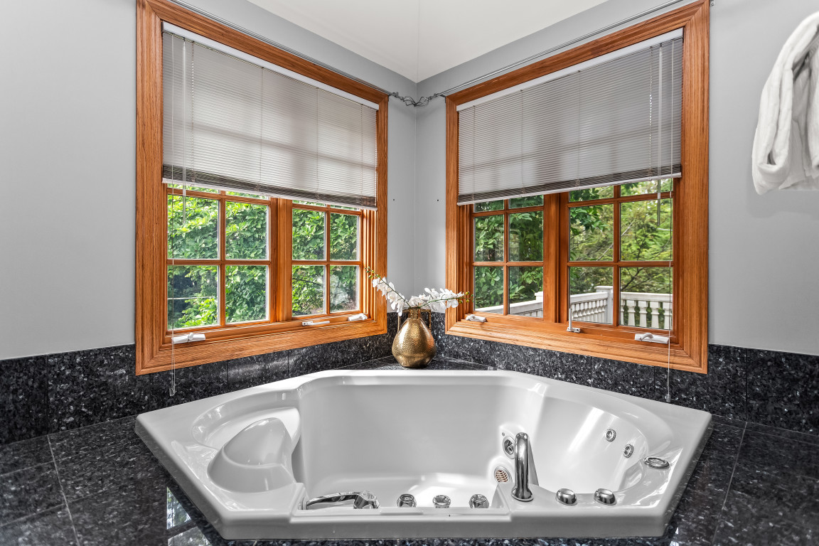 2236 Ridge Avenue Evanston, IL 60201 - Photo 36 of 68 a bath tub sitting in a bathroom next to a window