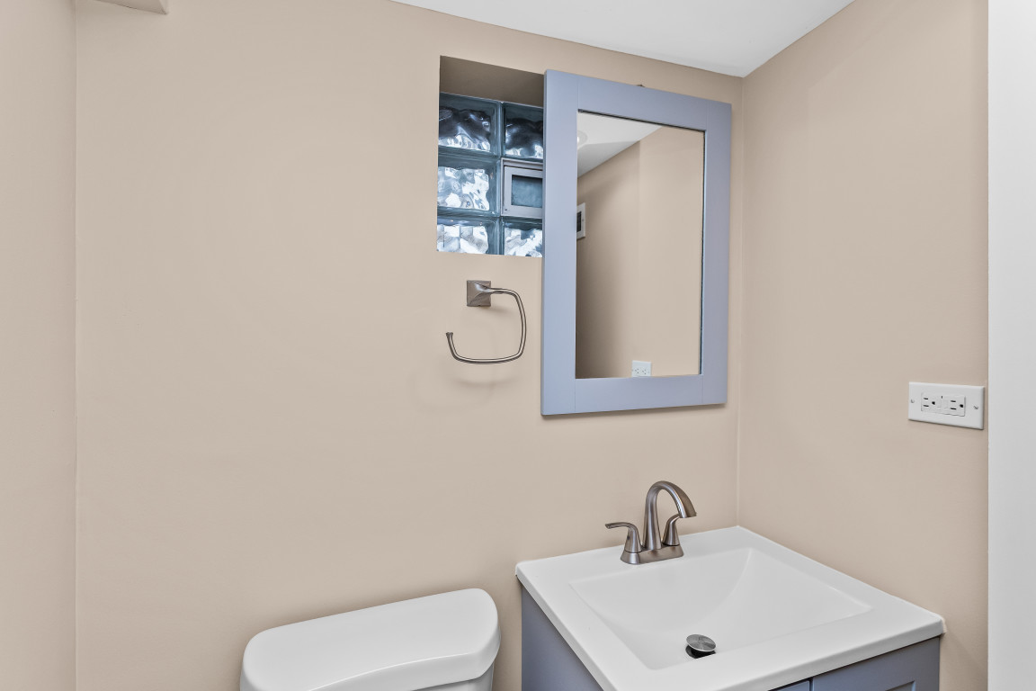 2236 Ridge Avenue Evanston, IL 60201 - Photo 60 of 68 a white toilet sitting next to a bathroom sink