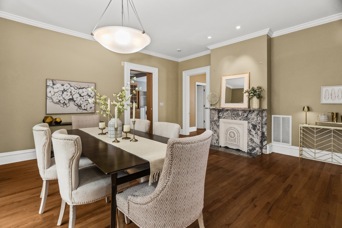2236 Ridge Avenue Evanston, IL 60201 - Photo 8 of 68 a view of a dining room with furniture wooden floor and a chandelier