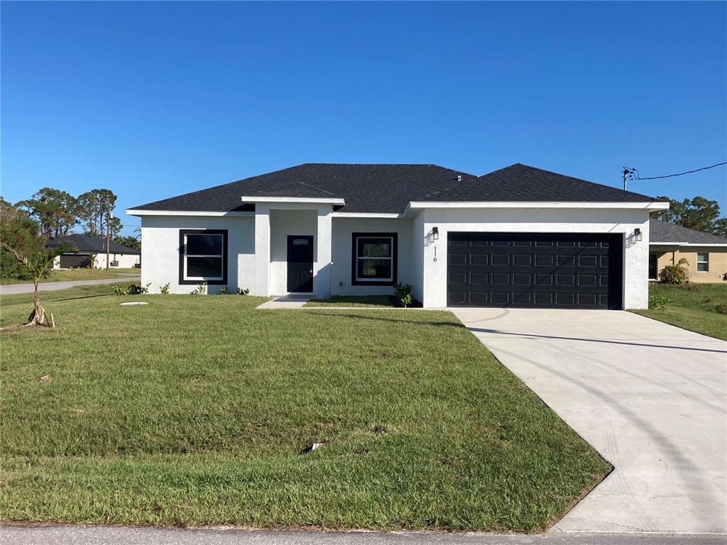 116 Venice Road Rotonda West, FL 33947 - Photo 1 of 1 a front view of a house with a yard
