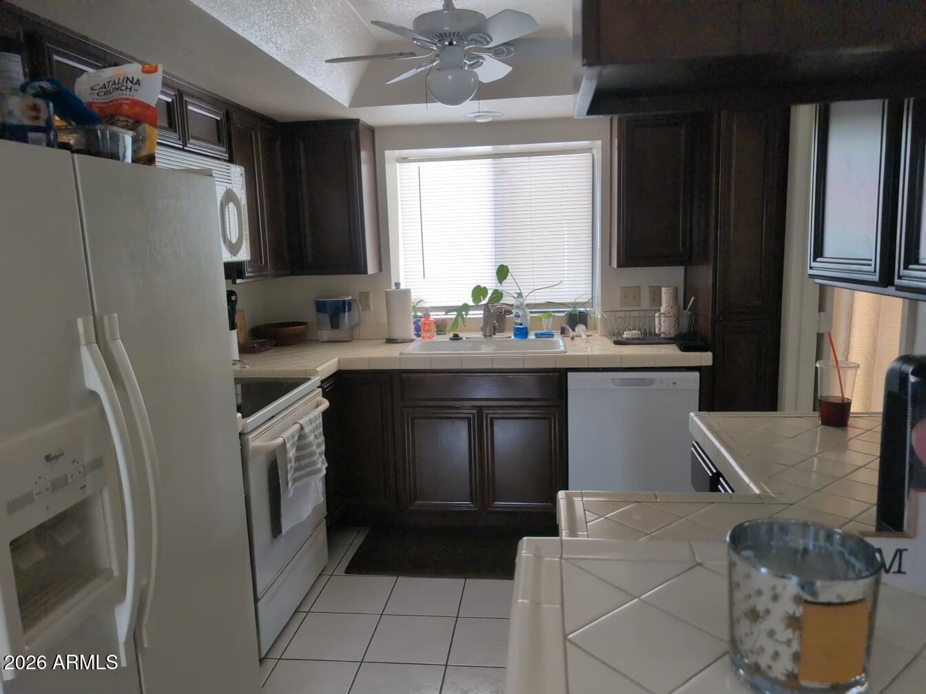 406 West Kings Avenue Phoenix, AZ 85023 - Photo 11 of 45 a kitchen with a sink appliances and cabinets