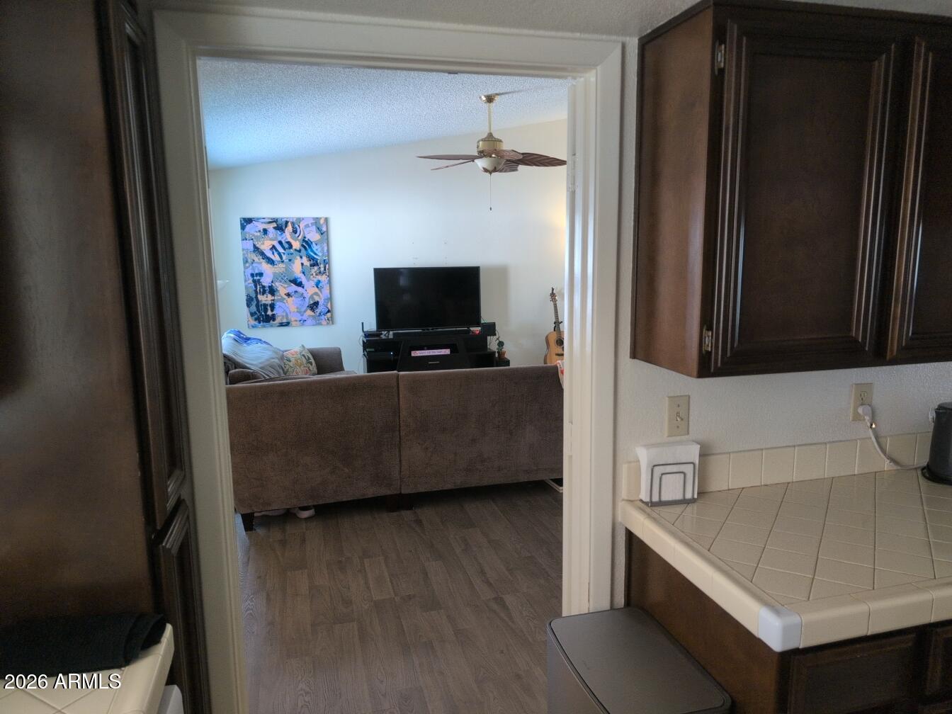 406 West Kings Avenue Phoenix, AZ 85023 - Photo 14 of 45 a living room with a flat screen tv a washer and dryer
