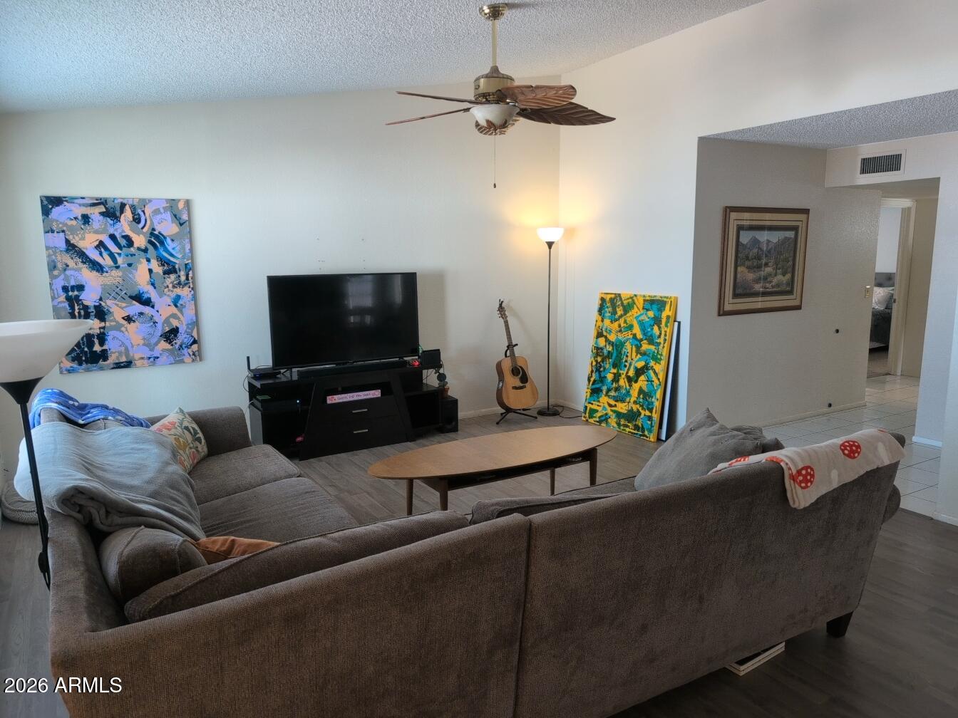 406 West Kings Avenue Phoenix, AZ 85023 - Photo 15 of 45 a living room with furniture and a flat screen tv