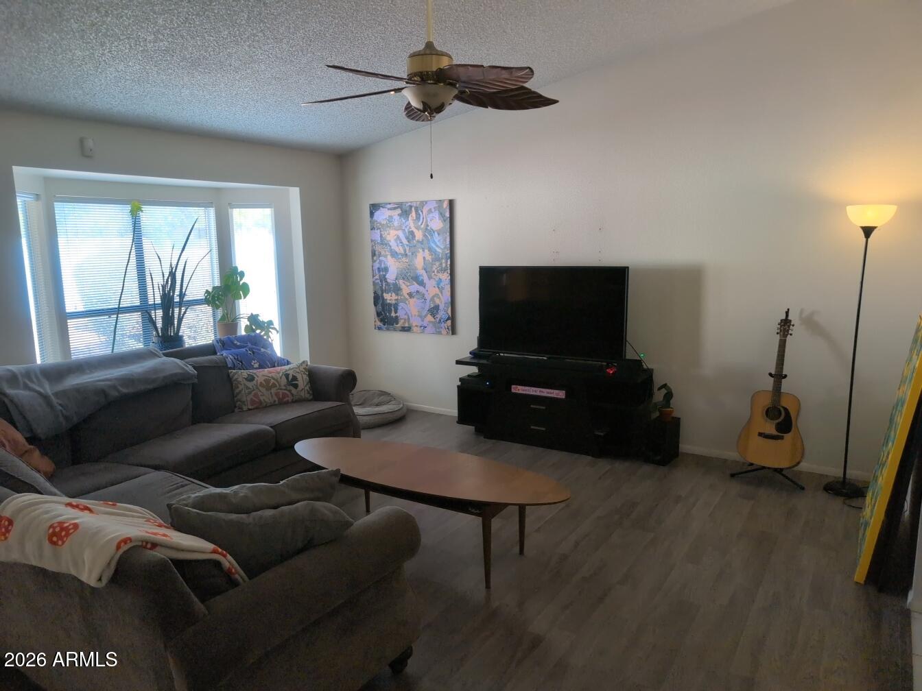 406 West Kings Avenue Phoenix, AZ 85023 - Photo 16 of 45 a living room with furniture and a flat screen tv
