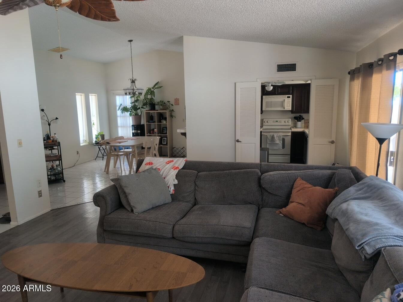 406 West Kings Avenue Phoenix, AZ 85023 - Photo 19 of 45 a living room with furniture and wooden floor