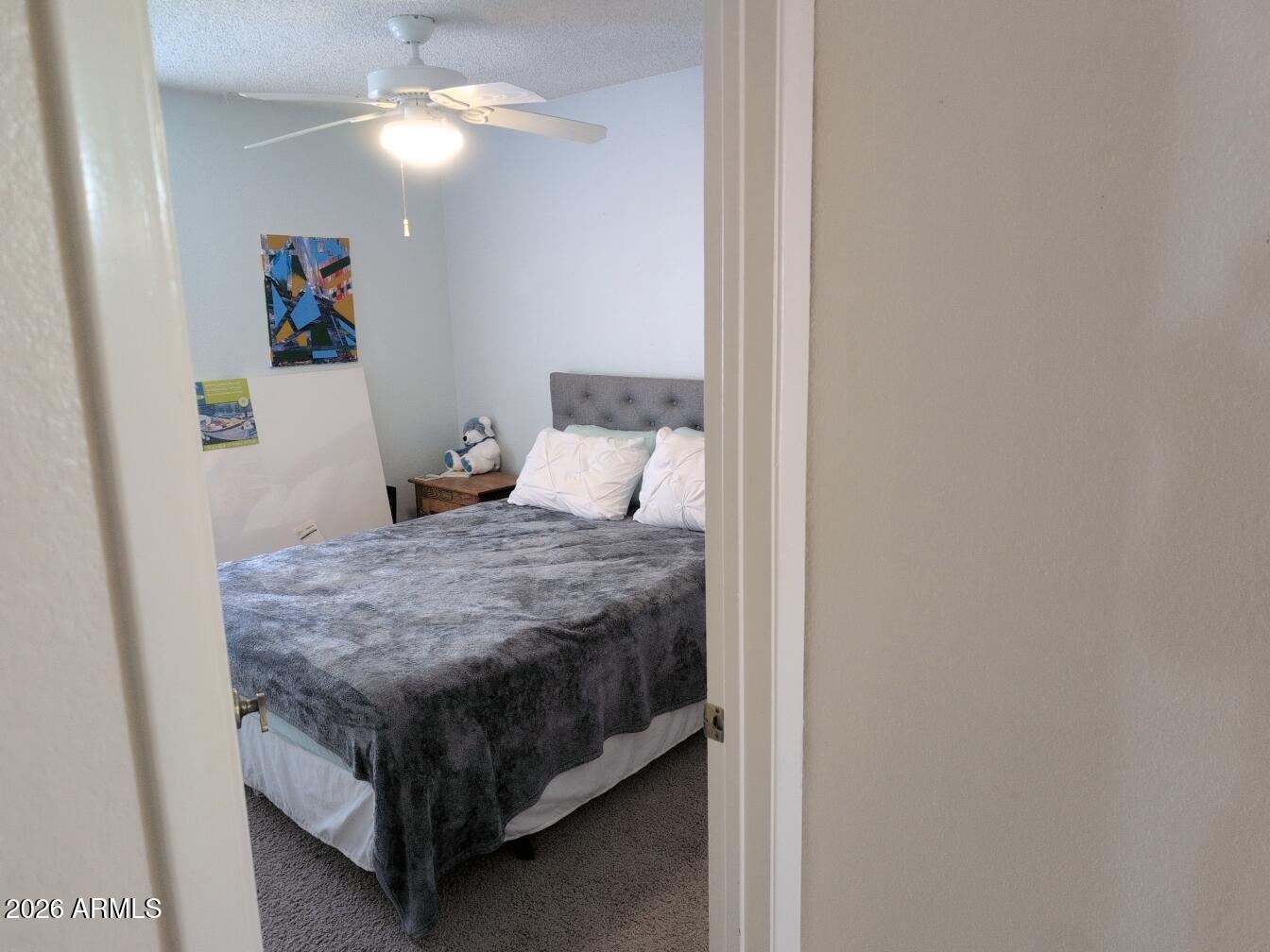 406 West Kings Avenue Phoenix, AZ 85023 - Photo 23 of 45 a bedroom with a bed and a chandelier