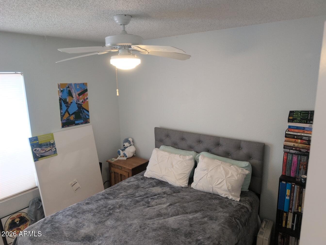 406 West Kings Avenue Phoenix, AZ 85023 - Photo 24 of 45 a bedroom with a bed and cabinets