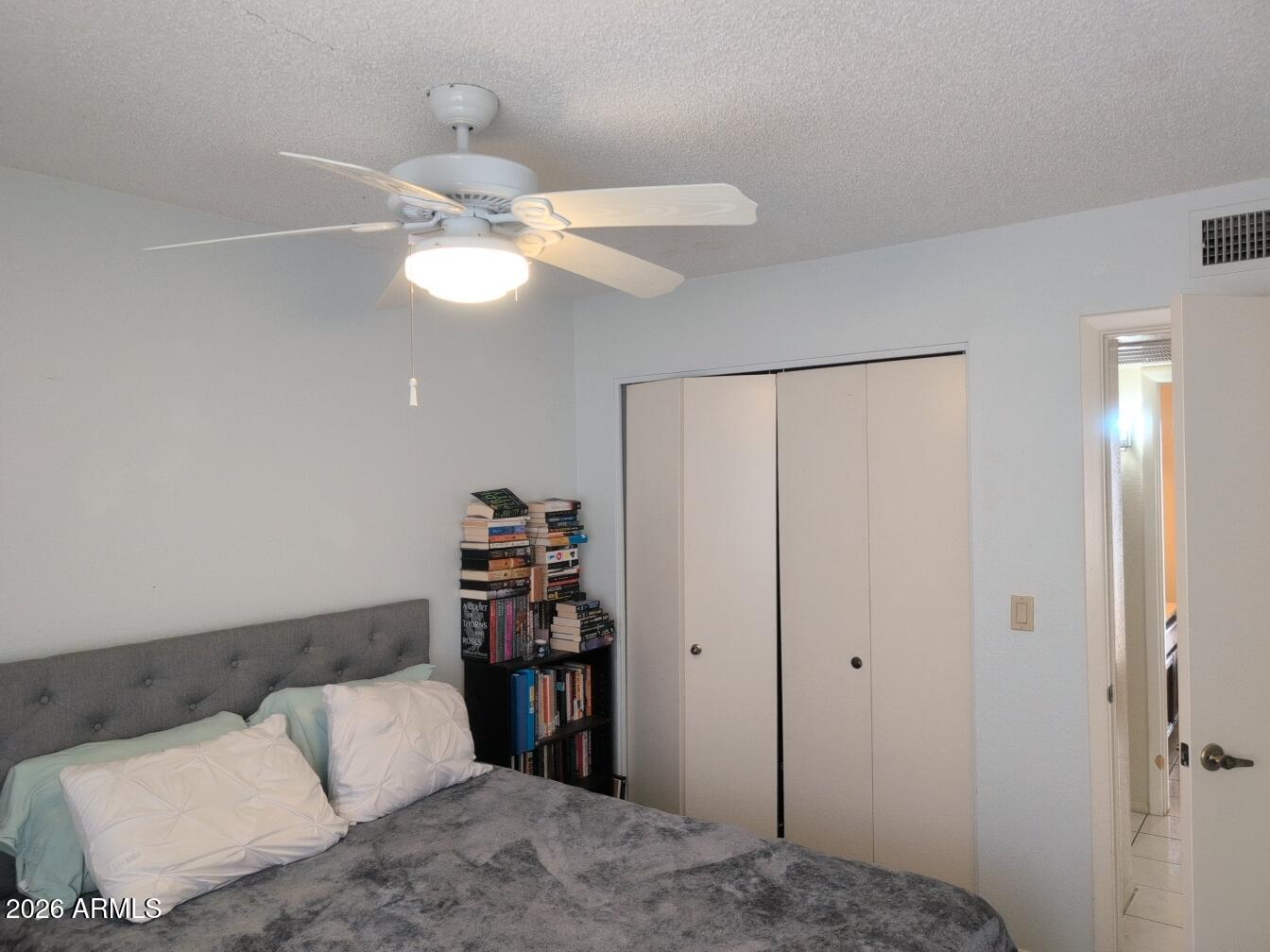 406 West Kings Avenue Phoenix, AZ 85023 - Photo 25 of 45 a bedroom with a bed and a chandelier fan