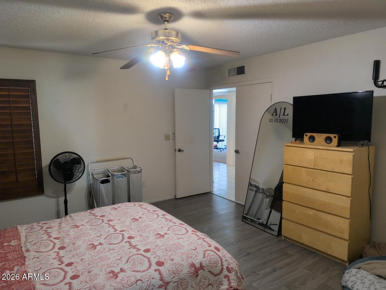 406 West Kings Avenue Phoenix, AZ 85023 - Photo 30 of 45 a bedroom with a bed and a flat screen tv