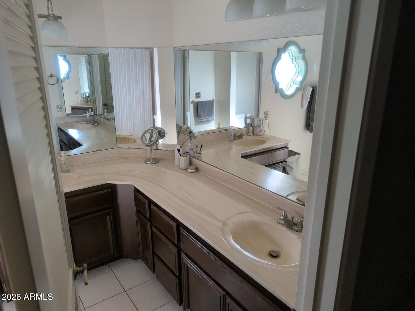 406 West Kings Avenue Phoenix, AZ 85023 - Photo 35 of 45 a bathroom with a sink and a mirror