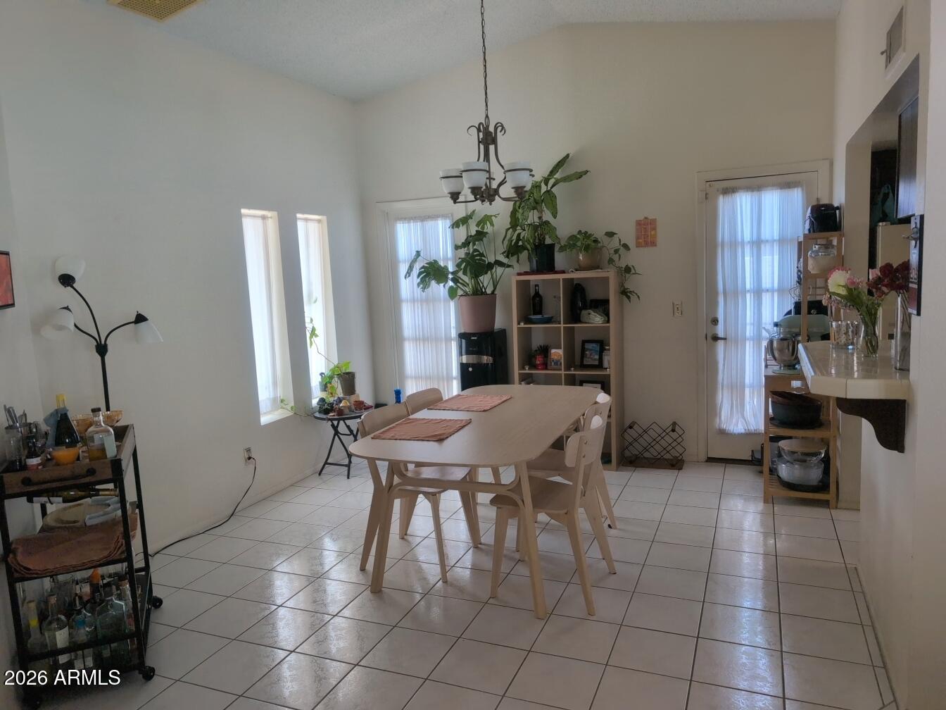 406 West Kings Avenue Phoenix, AZ 85023 - Photo 8 of 45 a dining room with furniture and a floor to ceiling window
