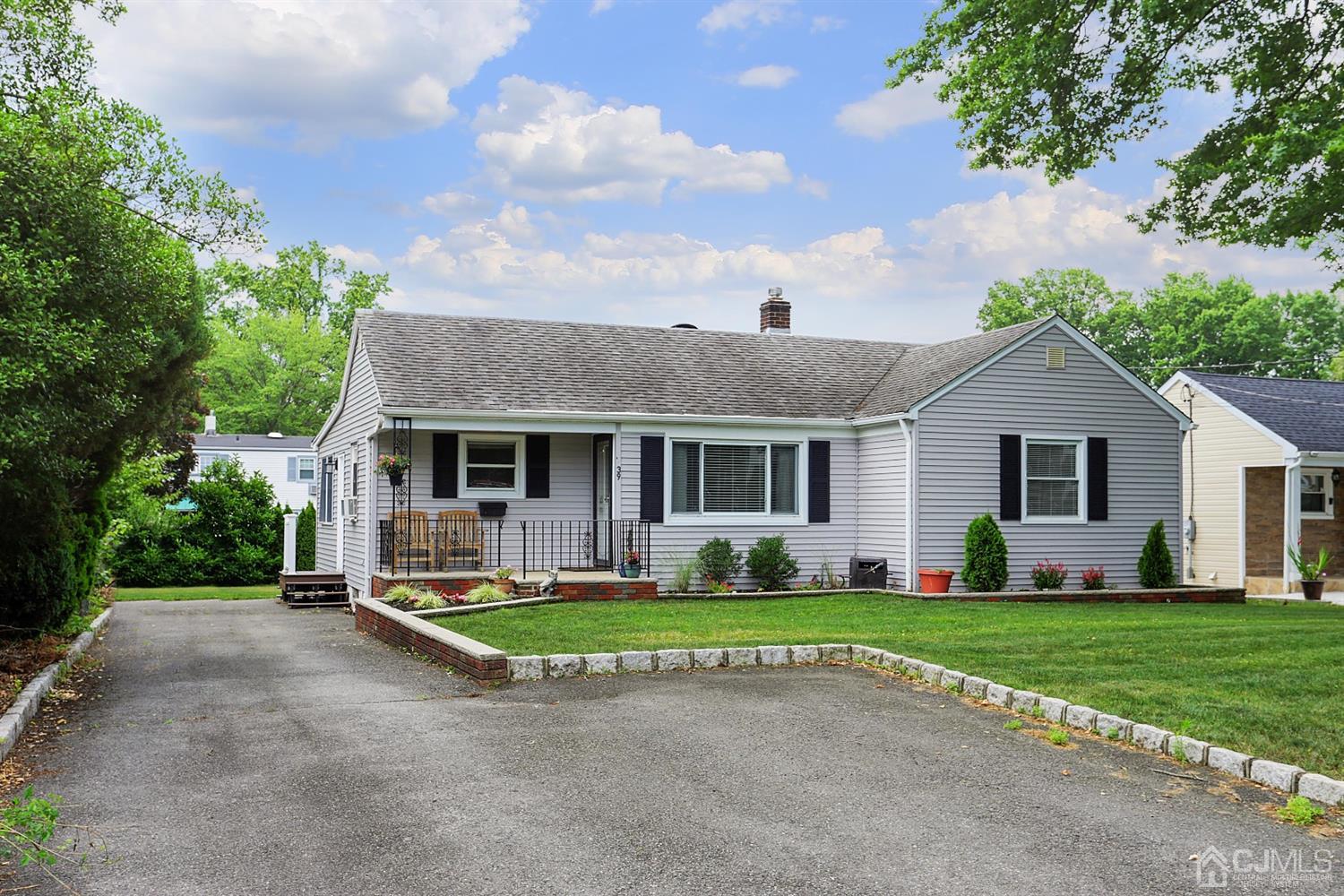 39 West Hill Road Colonia, NJ 07067 - Photo 1 of 26 a front view of house with yard and green space