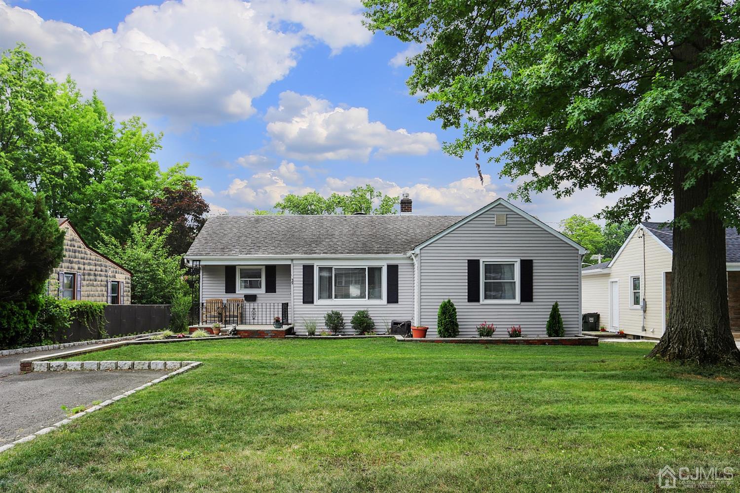39 West Hill Road Colonia, NJ 07067 - Photo 2 of 26 a front view of house with yard and green space