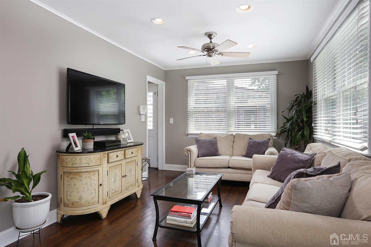 39 West Hill Road Colonia, NJ 07067 - Photo 11 of 26 a living room with furniture and a flat screen tv