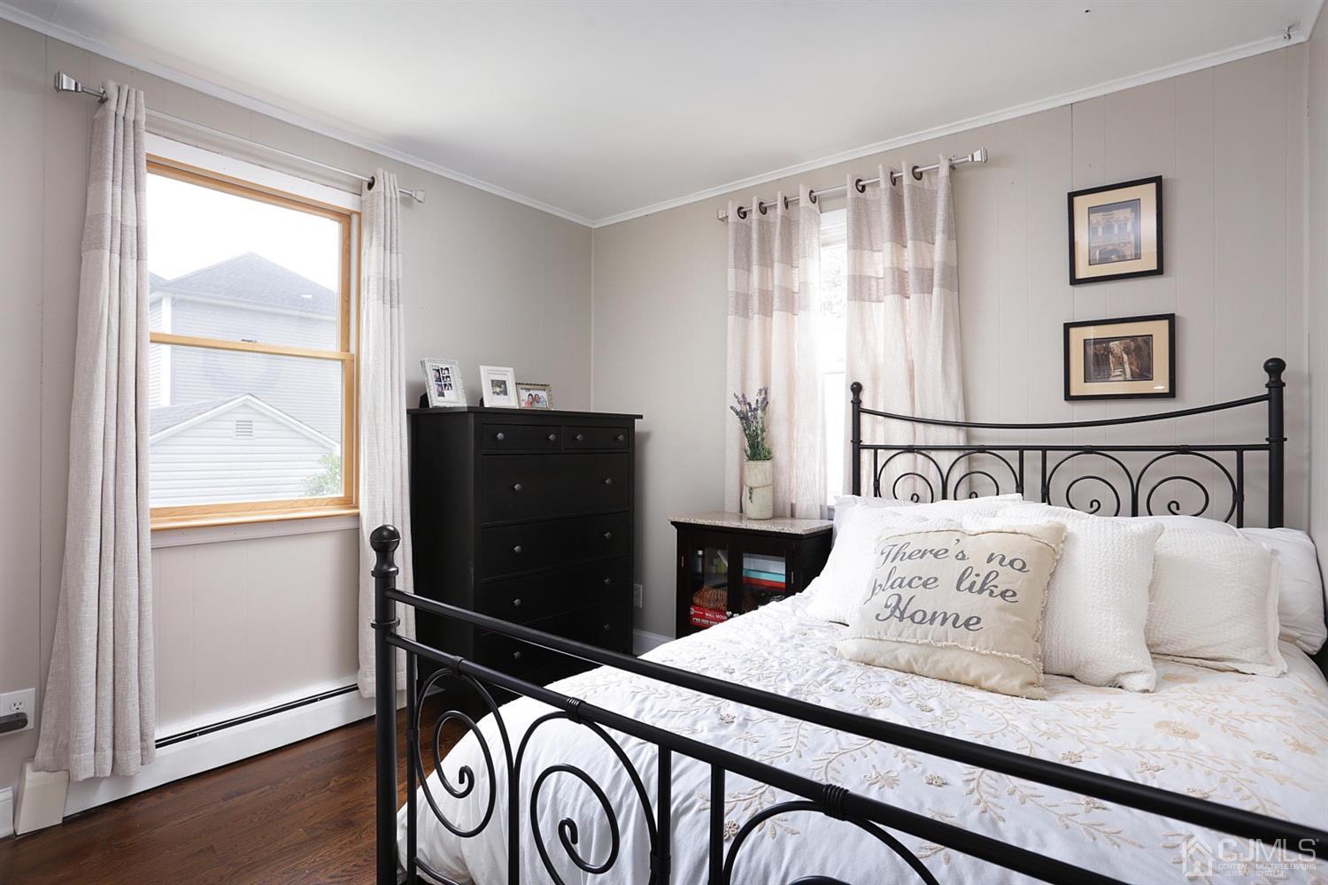 39 West Hill Road Colonia, NJ 07067 - Photo 16 of 26 a bedroom with a bed and wooden floor