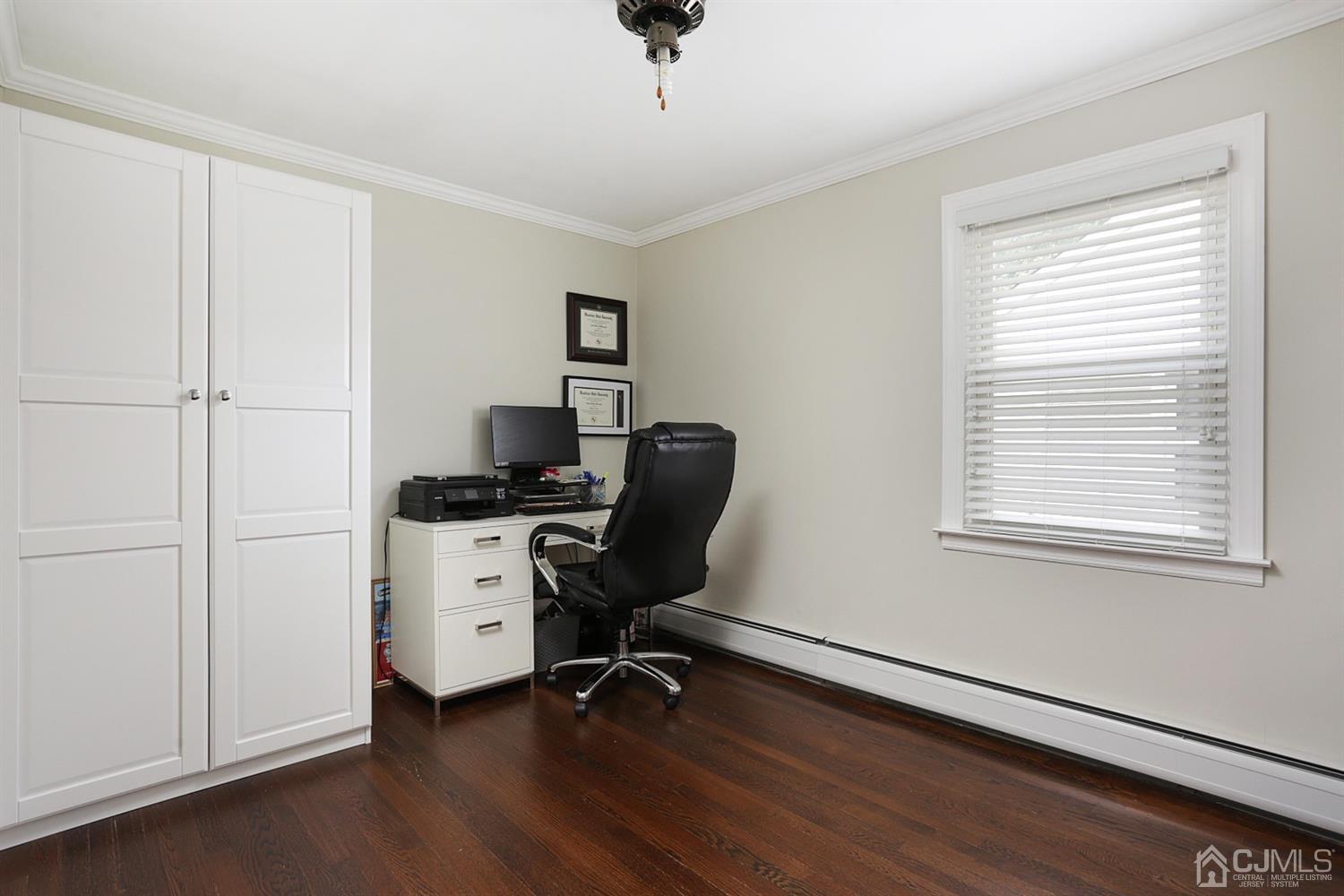39 West Hill Road Colonia, NJ 07067 - Photo 17 of 26 a view of a workspace with furniture and a window
