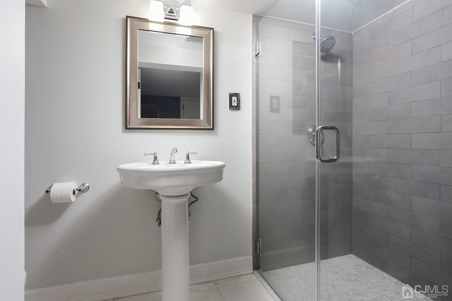 39 West Hill Road Colonia, NJ 07067 - Photo 21 of 26 a bathroom with a sink toilet and shower