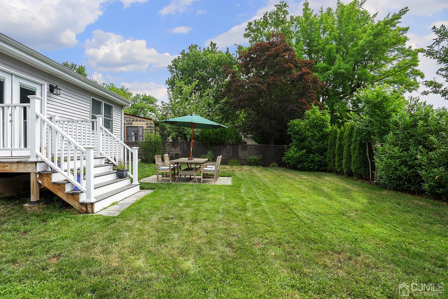 39 West Hill Road Colonia, NJ 07067 - Photo 23 of 26 a view of a house with backyard porch and sitting area