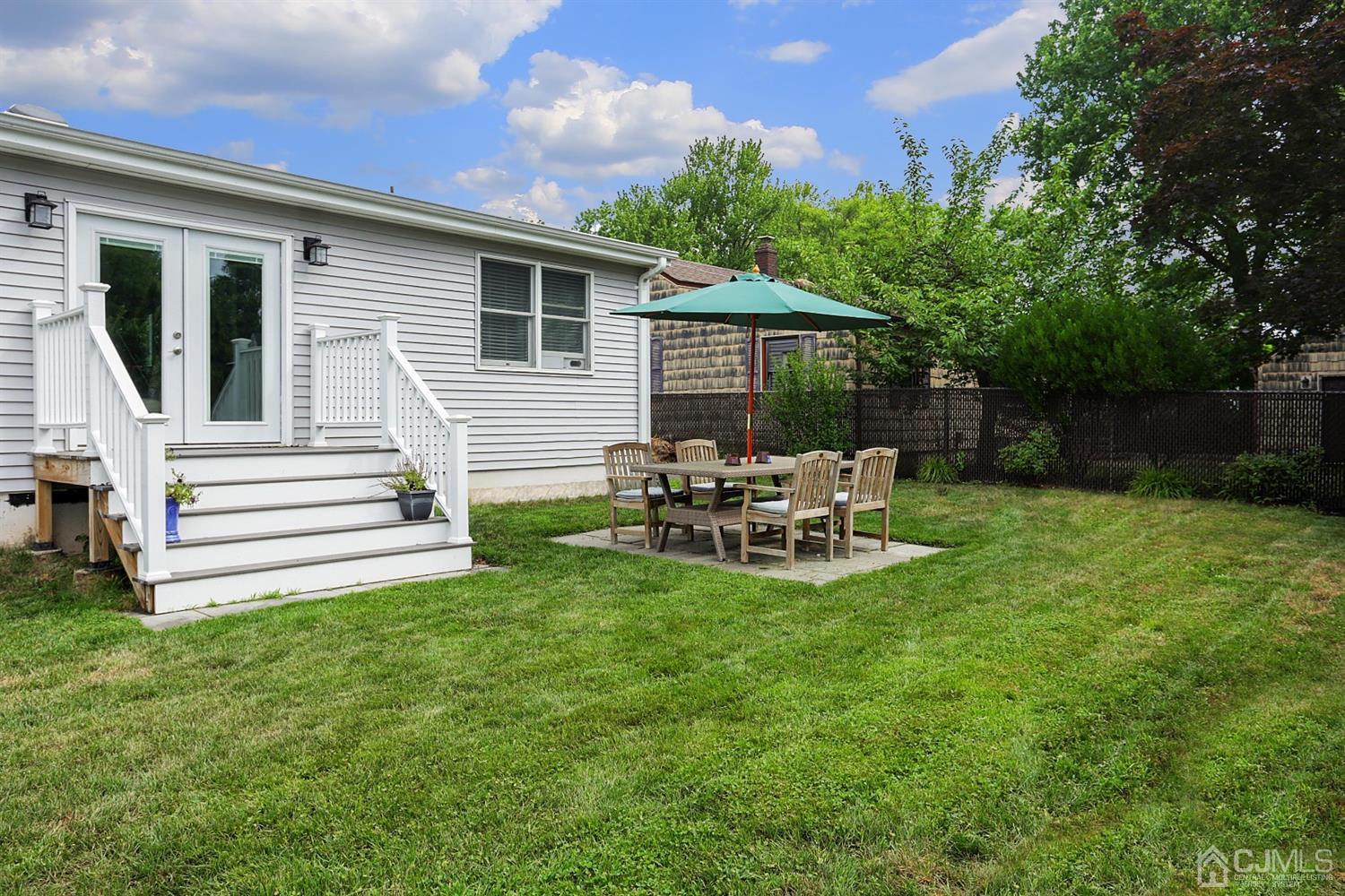 39 West Hill Road Colonia, NJ 07067 - Photo 24 of 26 a view of a chair and table in backyard of the house