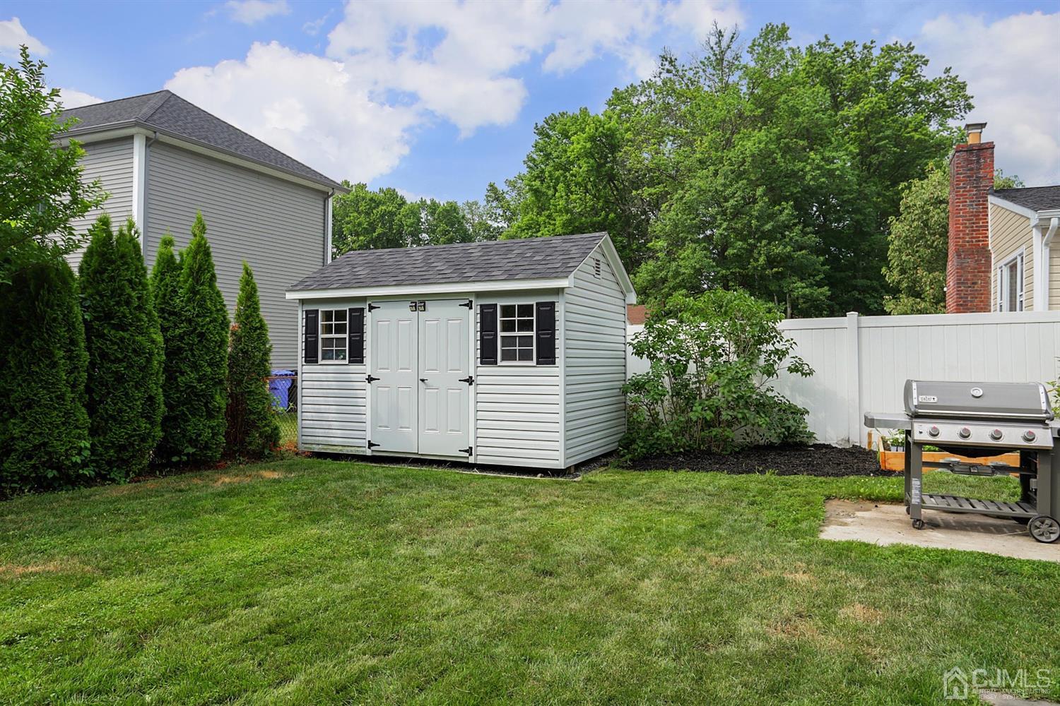 39 West Hill Road Colonia, NJ 07067 - Photo 25 of 26 a view of a house with a yard