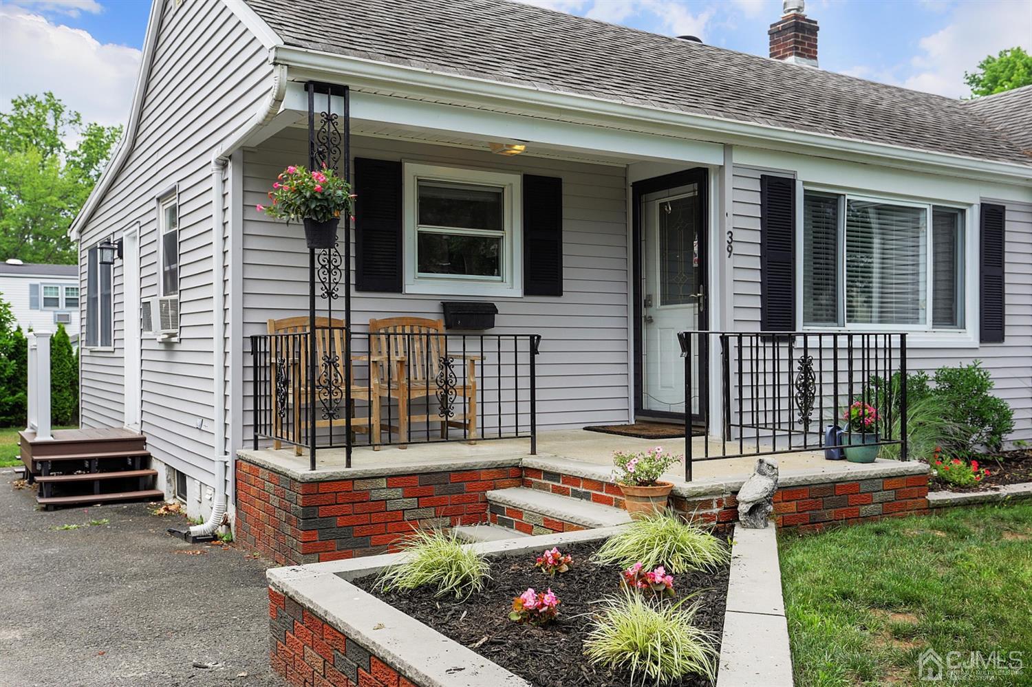 39 West Hill Road Colonia, NJ 07067 - Photo 5 of 26 front view of a house with a yard