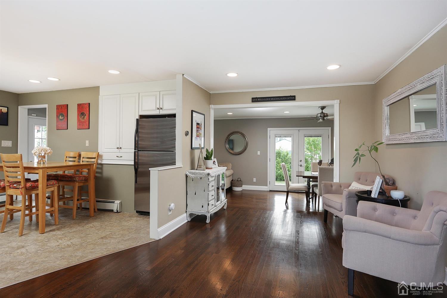 39 West Hill Road Colonia, NJ 07067 - Photo 6 of 26 a living room with furniture kitchen view and a large window