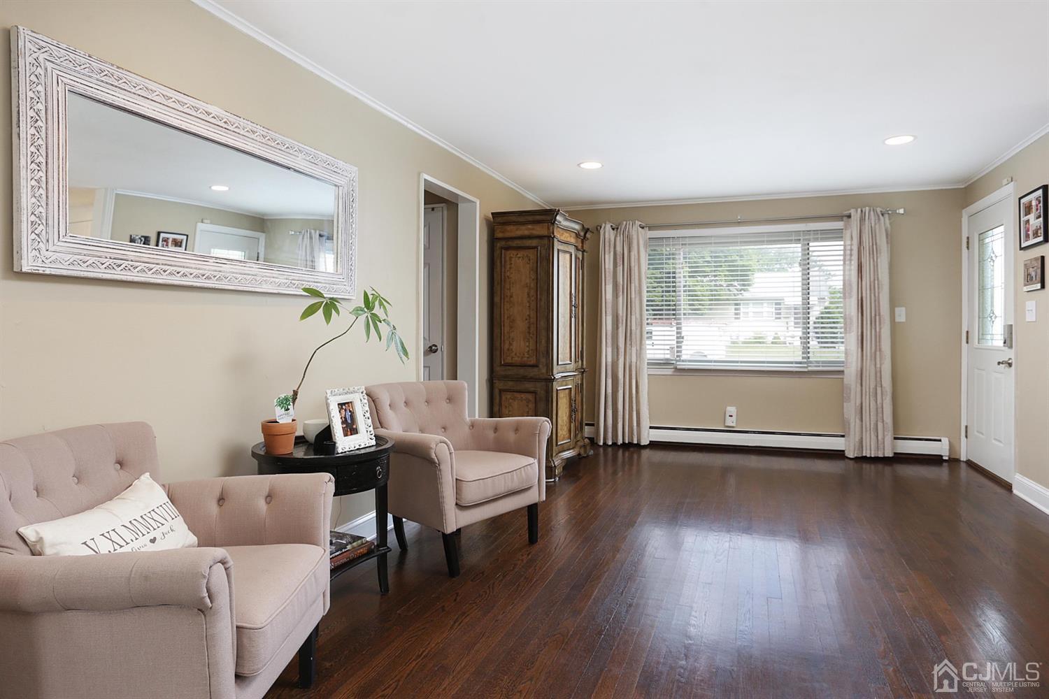 39 West Hill Road Colonia, NJ 07067 - Photo 8 of 26 a living room with furniture and wooden floor
