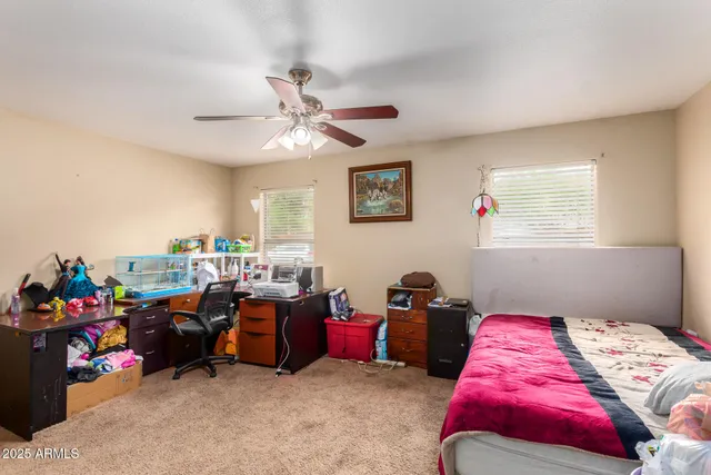 a bed room with furniture and a window