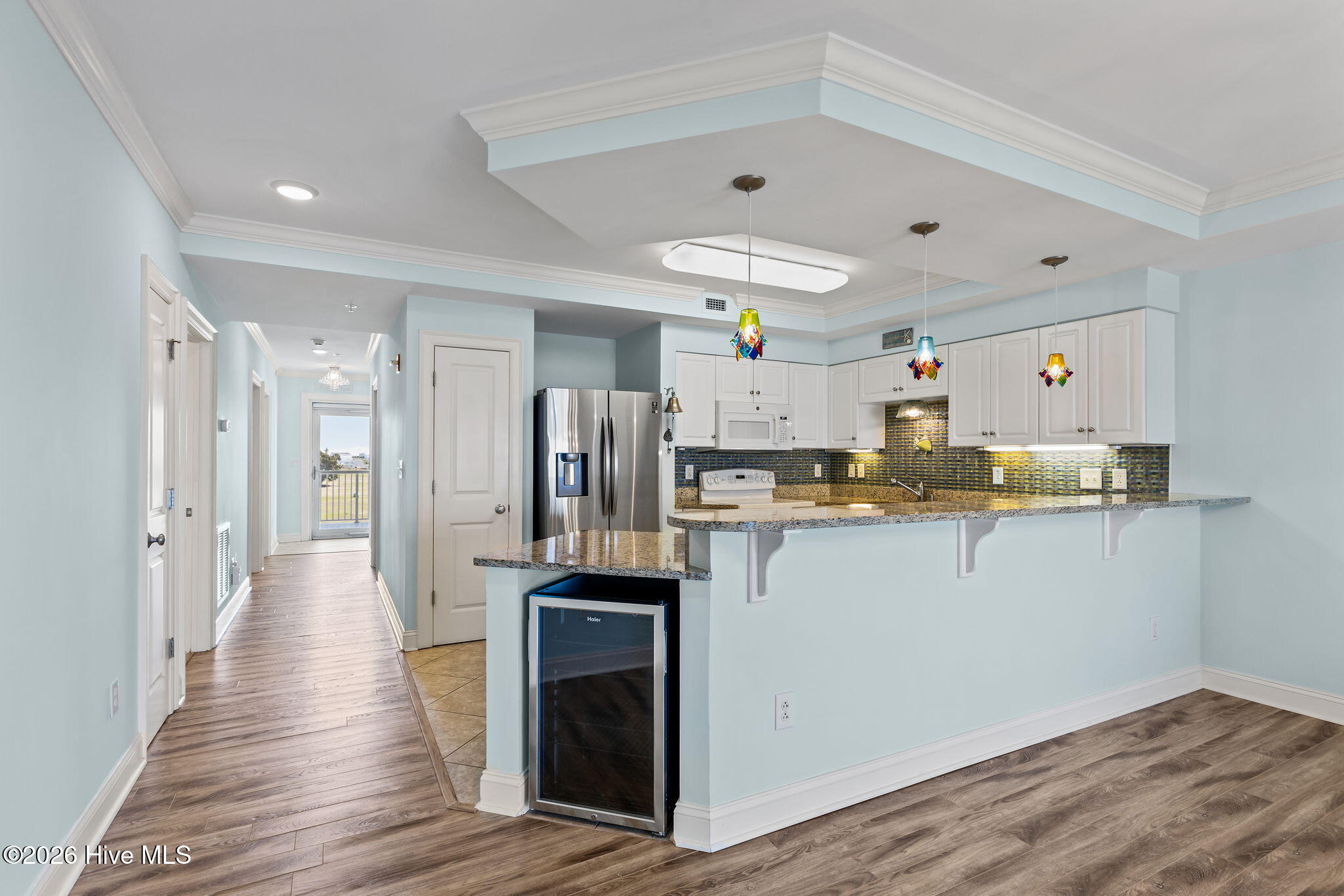 1550 Salter Path Road, Unit 102 Indian Beach, NC 28512 - Photo 25 of 88 with bar seating area and wine fridge
