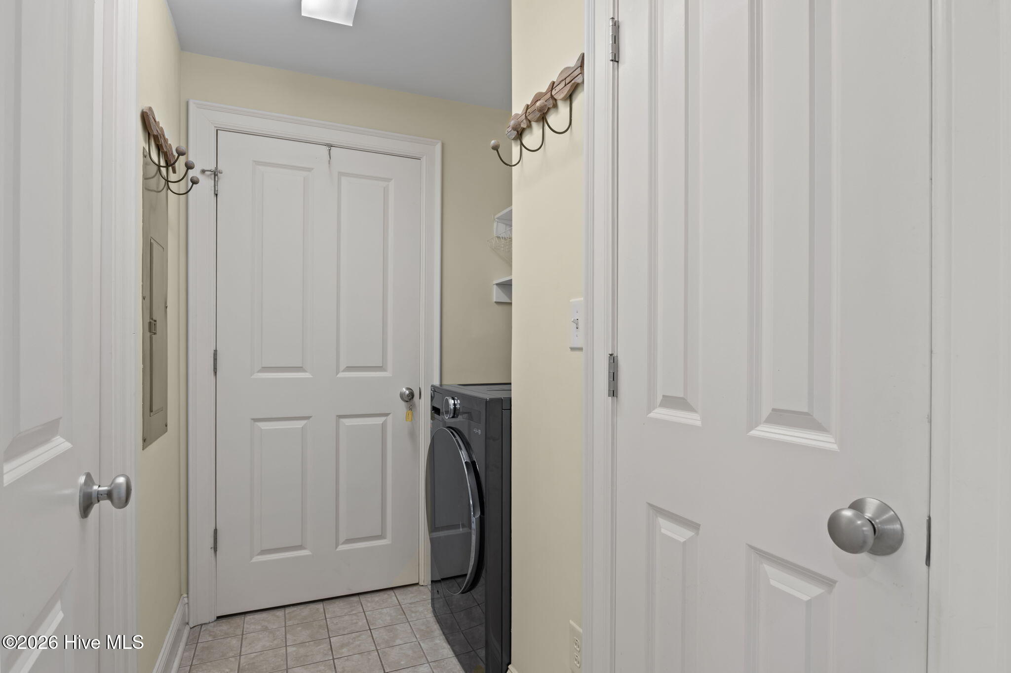 1550 Salter Path Road, Unit 102 Indian Beach, NC 28512 - Photo 44 of 89 Washer/Dryer combo and access to storage room