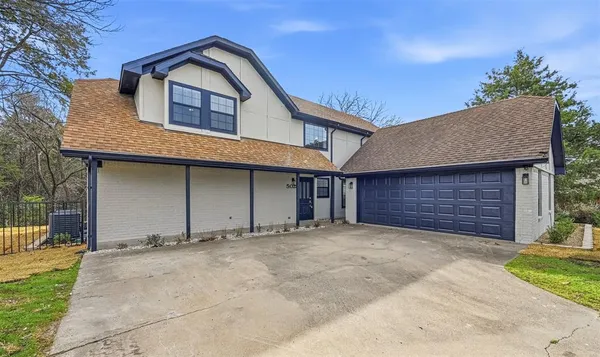 a front view of a house with a garage