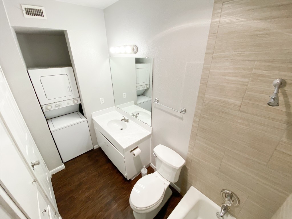2529 Rio Grande Street, Unit 34 Austin, TX 78705 - Photo 13 of 17 a white toilet sitting next to a bathroom sink