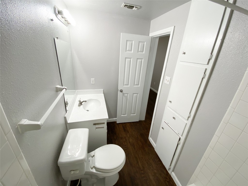 2529 Rio Grande Street, Unit 34 Austin, TX 78705 - Photo 14 of 17 a white toilet sitting next to a sink