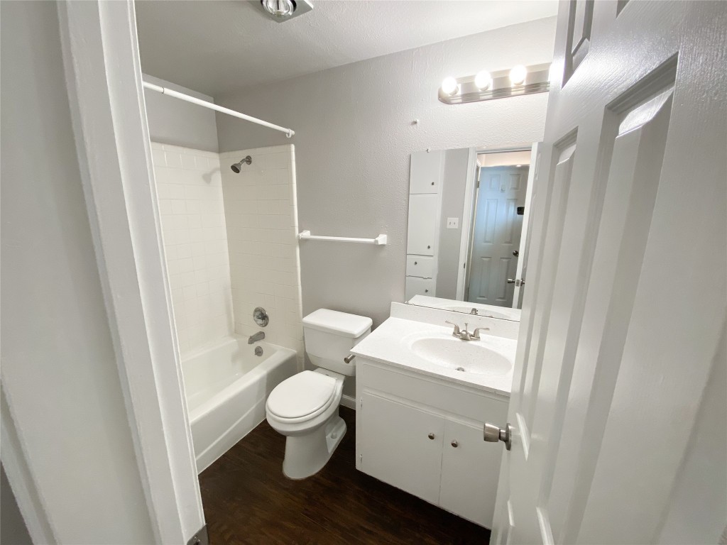 2529 Rio Grande Street, Unit 34 Austin, TX 78705 - Photo 15 of 17 a bathroom with a sink a toilet a tub and shower