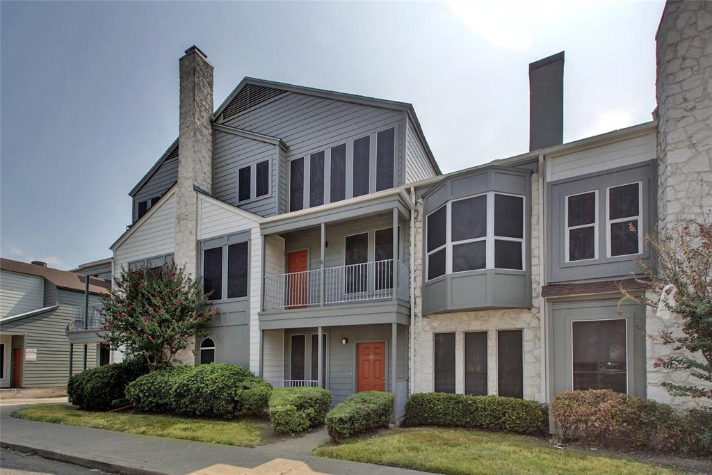 2529 Rio Grande Street, Unit 34 Austin, TX 78705 - Photo 16 of 17 a front view of a house with garden