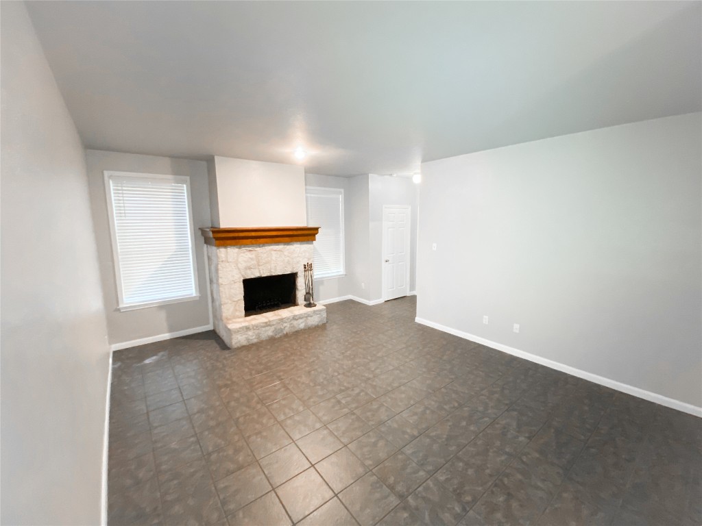 2529 Rio Grande Street, Unit 34 Austin, TX 78705 - Photo 2 of 17 a view of empty room with a fireplace