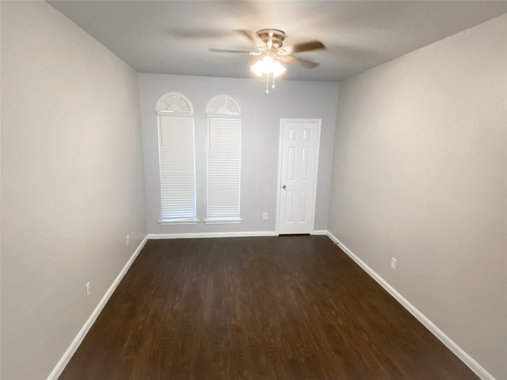 2529 Rio Grande Street, Unit 34 Austin, TX 78705 - Photo 7 of 17 an empty room with wooden floor fan and window