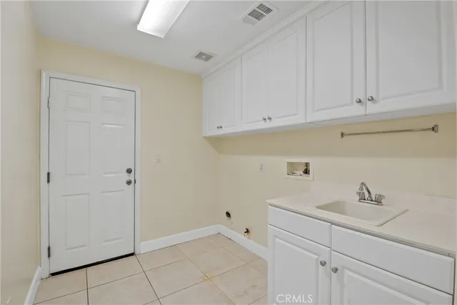 a view of room with white cabinets