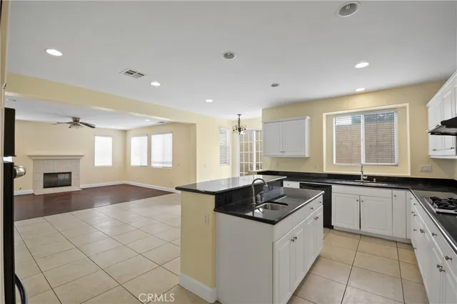 a kitchen with a sink stove and microwave