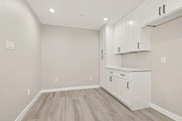 a view of kitchen with wooden floor