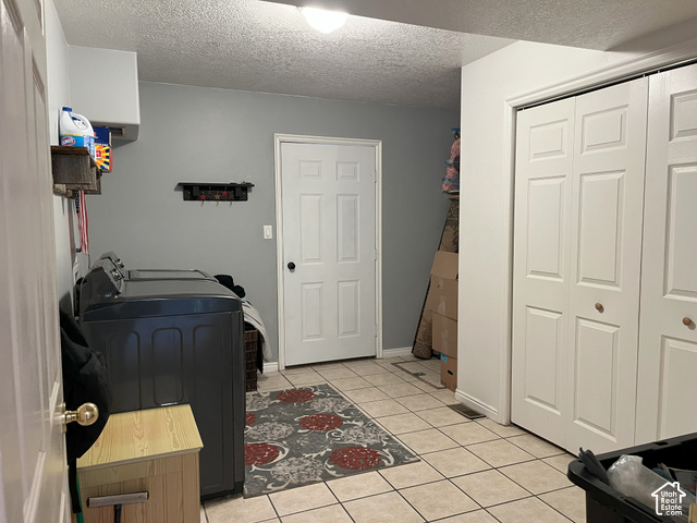 750 South Big Road Soda Springs, ID 83276 - Photo 40 of 40 Tile flooring with contrasting grout lines, bi-fold closet doors, and painted walls