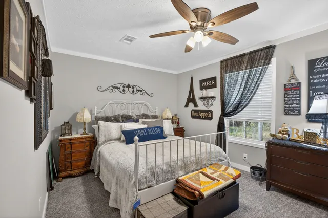 a bedroom with furniture and a window