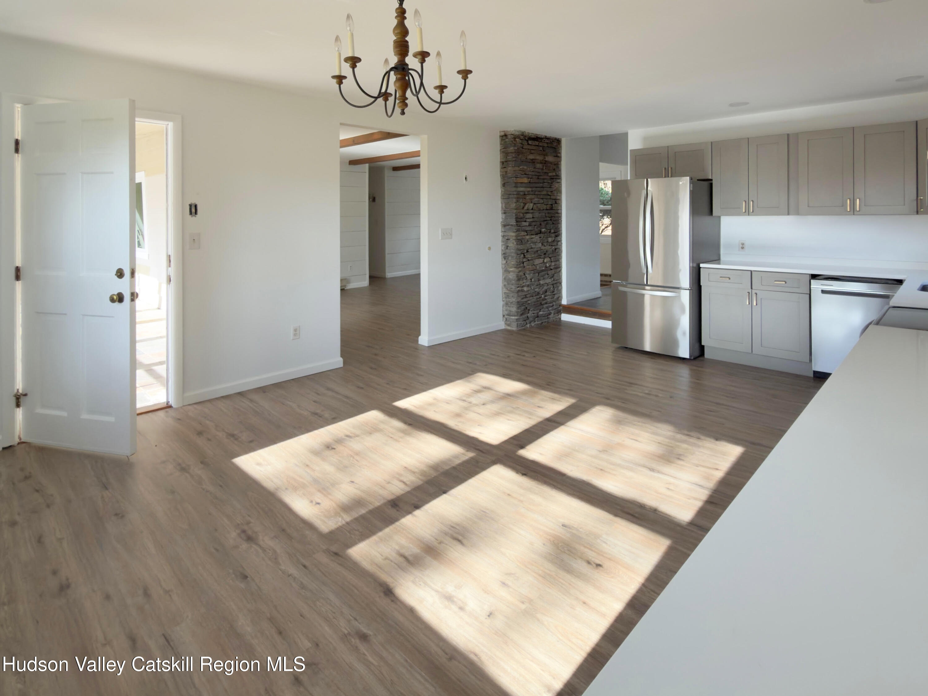 13 Heyden Road Shokan, NY 12481 - Photo 13 of 37 a view of a hallway with wooden floor and a kitchen